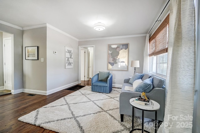 living room with crown molding and hardwood / wood-style floors