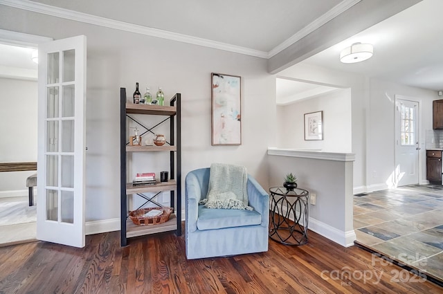 living area featuring dark hardwood / wood-style flooring and ornamental molding