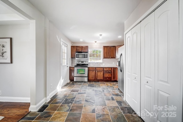 kitchen featuring tasteful backsplash and appliances with stainless steel finishes