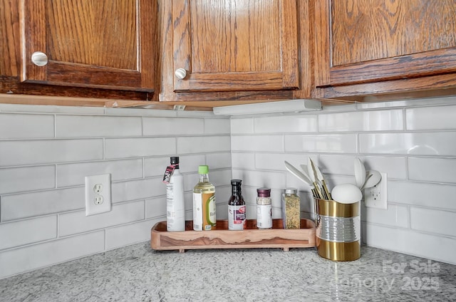 details featuring light stone countertops