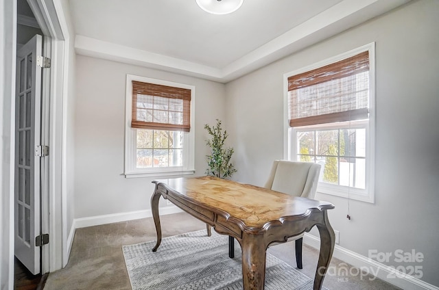 home office featuring dark colored carpet