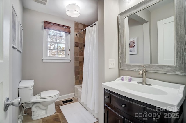 full bathroom with shower / bath combo, vanity, and toilet