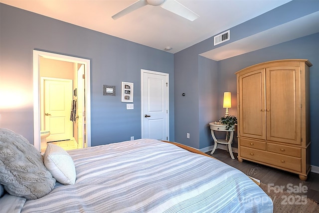 bedroom featuring dark hardwood / wood-style floors, connected bathroom, and ceiling fan