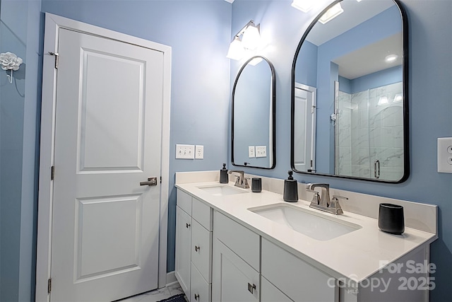 bathroom featuring vanity and a shower with door