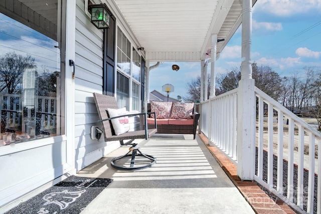 balcony featuring a porch