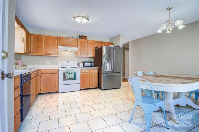 kitchen with hanging light fixtures, light tile patterned flooring, an inviting chandelier, and black appliances