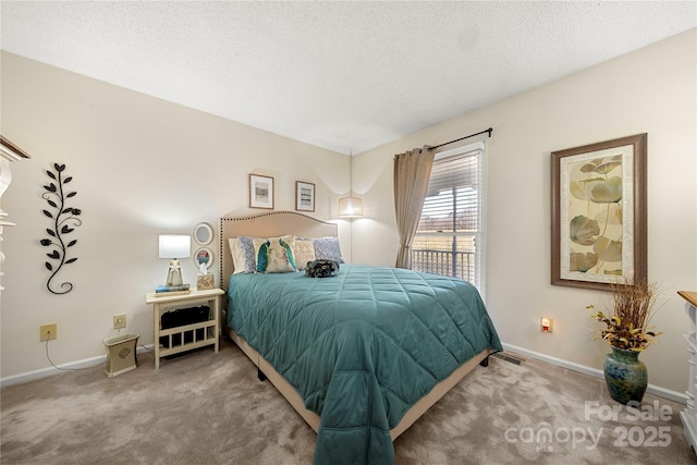 carpeted bedroom with a textured ceiling