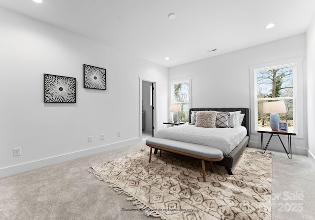 bedroom with light colored carpet