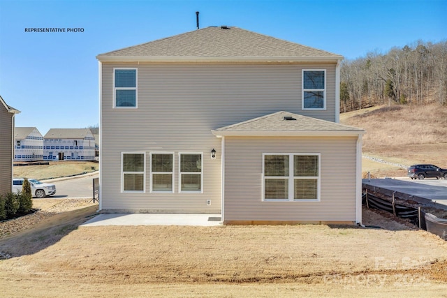 back of house with a patio