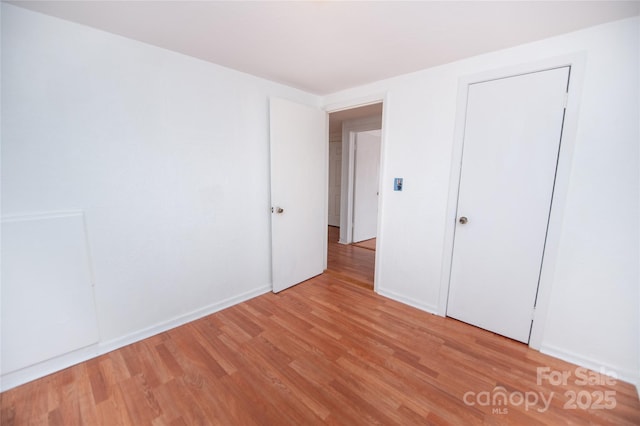 unfurnished bedroom featuring light hardwood / wood-style floors