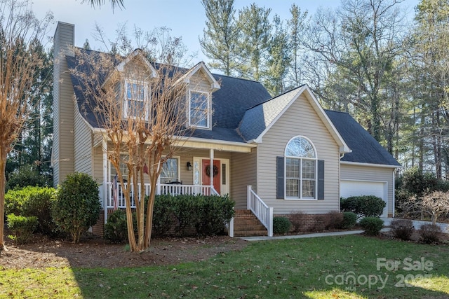 cape cod-style house featuring a garage, a front lawn, and a porch