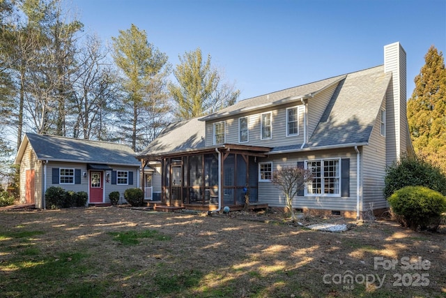 rear view of property with a sunroom