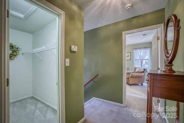 interior space with carpet flooring and a textured ceiling