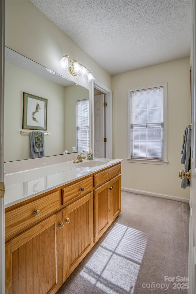 bathroom with vanity and a textured ceiling