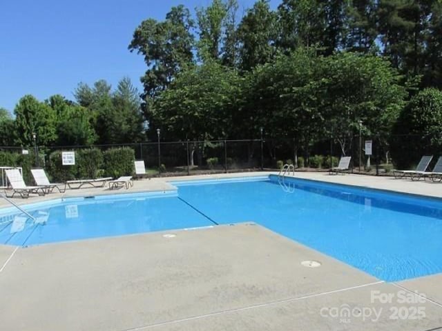 4617 Harbor View Ter, Morganton, NC 28655 - community pool featuring view of scattered trees and a patio area