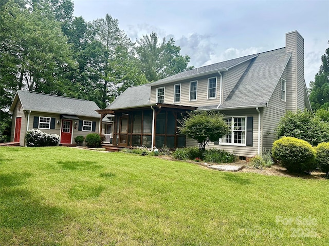 4617 Harbor View Ter, Morganton, NC 28655 - view of front of house featuring a front yard, a chimney, and a sunroom