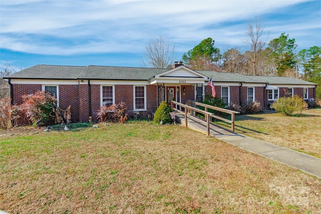 ranch-style home featuring a front lawn