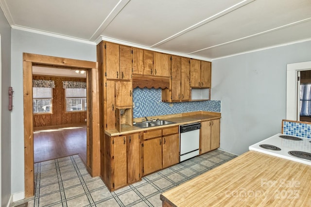 kitchen with tasteful backsplash, light countertops, ornamental molding, a sink, and dishwasher