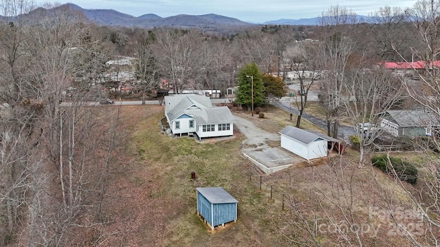 drone / aerial view featuring a mountain view
