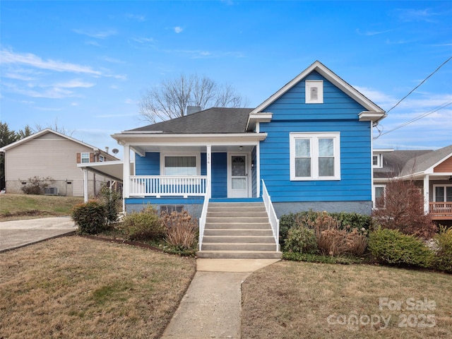 bungalow-style home featuring central AC, a front lawn, and covered porch