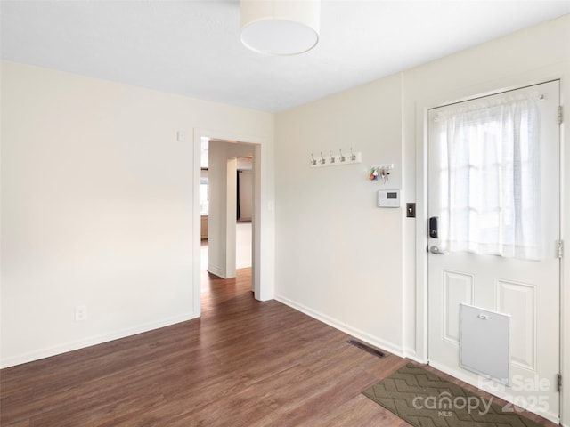 foyer entrance featuring dark hardwood / wood-style flooring