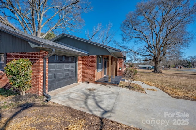 view of side of home featuring a garage