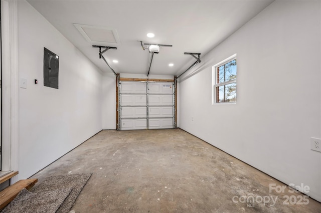 garage featuring a garage door opener and electric panel