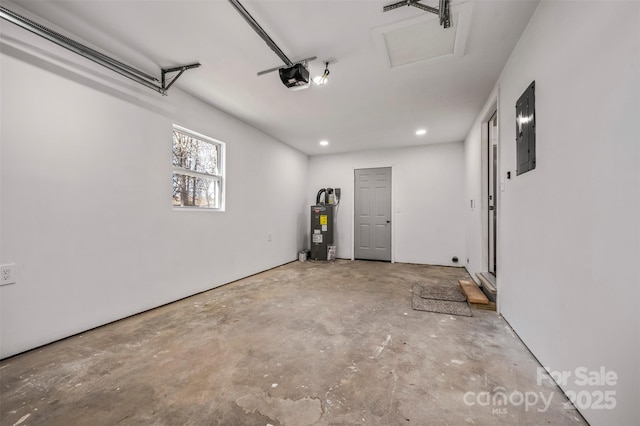 garage with a garage door opener, electric panel, and water heater