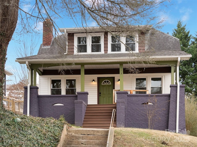 view of front of property featuring covered porch