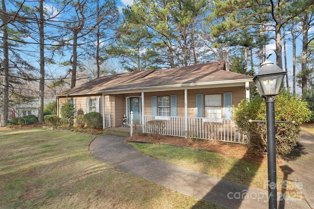 view of front of property with covered porch and a front lawn