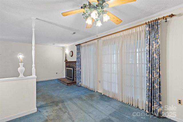 unfurnished living room with carpet floors, a fireplace, visible vents, and crown molding