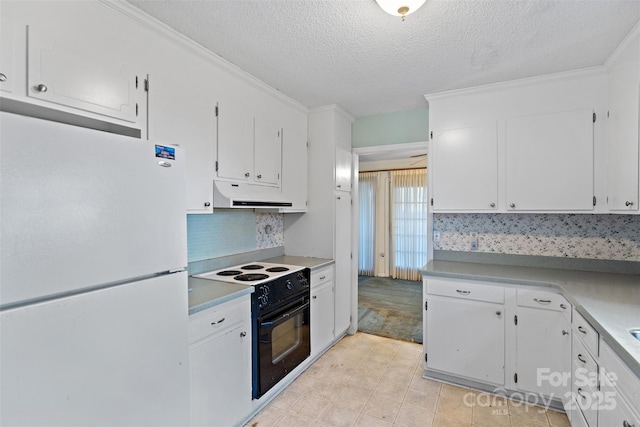 kitchen featuring light countertops, black electric range oven, freestanding refrigerator, white cabinets, and under cabinet range hood