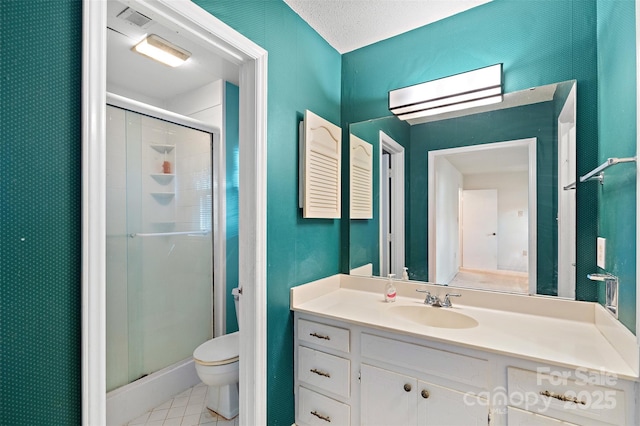 full bath featuring vanity, tile patterned flooring, a shower stall, and toilet