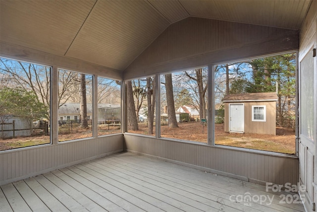 unfurnished sunroom with lofted ceiling and a healthy amount of sunlight