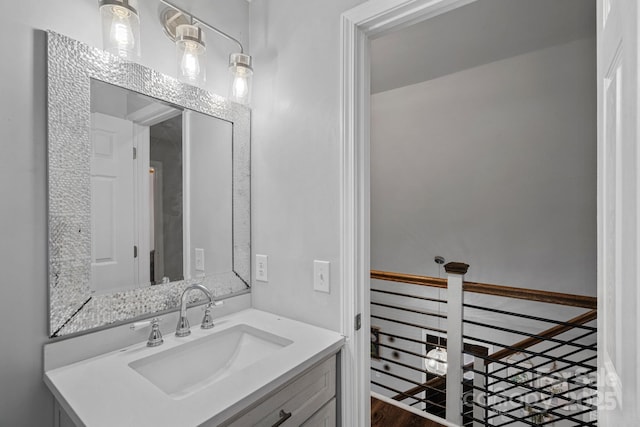 bathroom featuring hardwood / wood-style flooring and vanity