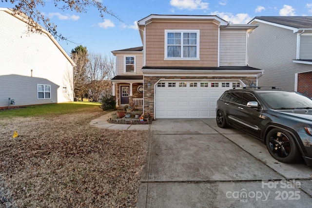 front of property with a garage and a front lawn