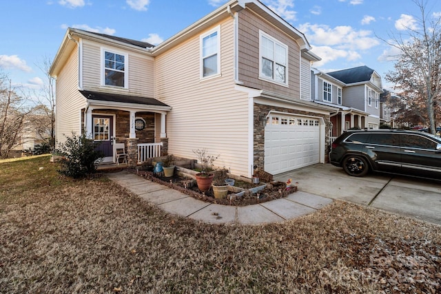 view of front of house featuring a garage and covered porch