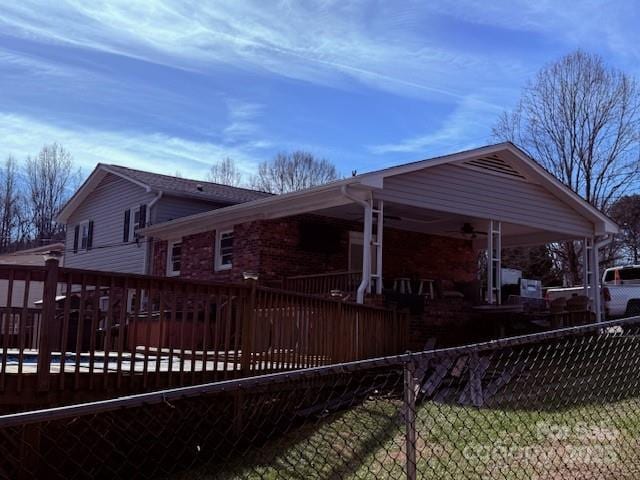 view of home's exterior featuring a wooden deck