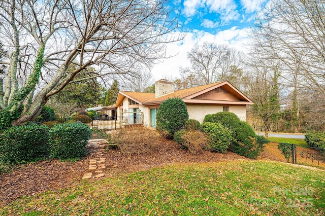 view of side of property featuring a yard