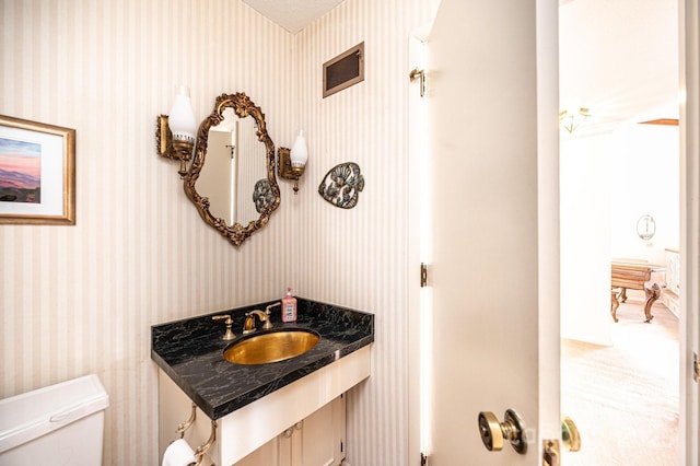 bathroom with sink and toilet