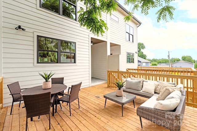 wooden deck featuring an outdoor living space