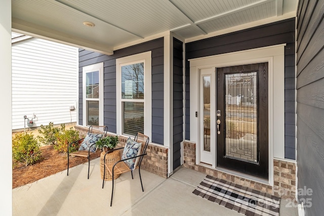 doorway to property with a porch