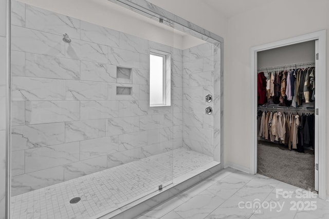 bathroom featuring a tile shower