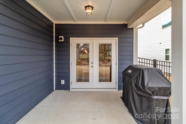 doorway to property featuring french doors