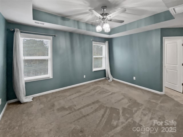 carpeted spare room with ceiling fan