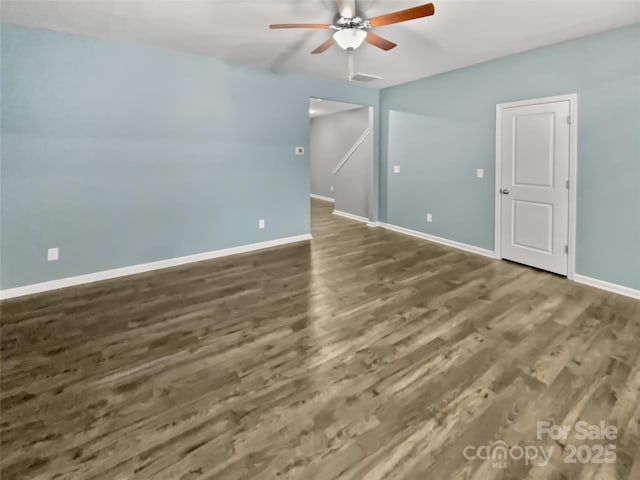 unfurnished room featuring dark hardwood / wood-style flooring and ceiling fan