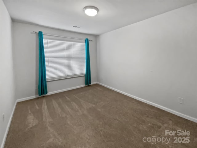 carpeted empty room featuring a healthy amount of sunlight