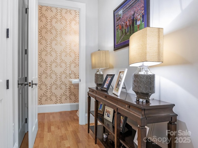 hallway with light wood-type flooring