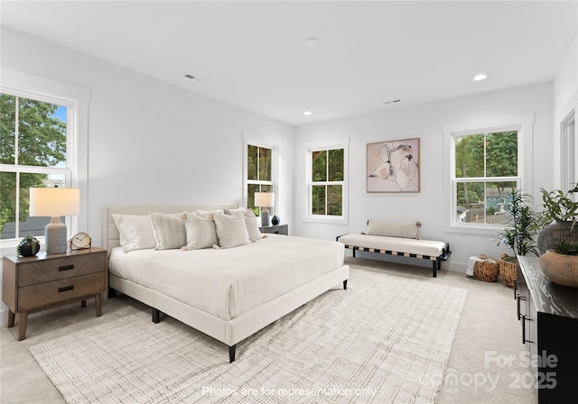 bedroom featuring light colored carpet, recessed lighting, visible vents, and baseboards