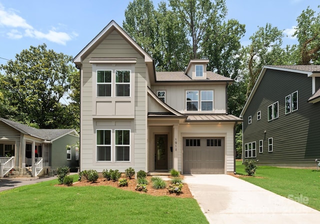 1912 St John St, Charlotte, NC 28216 - view of front facade featuring a standing seam roof, a front yard, driveway, and a metal roof